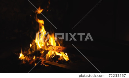 Forge fire in furnace. Blacksmith tempers a steel product in a stove. Smithy forging for hardening and heating iron. Blacksmith stove. Slow Motion. 72233267