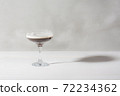 Jelly coffee with milk in a glass bowl in soft light. White background. 72234362