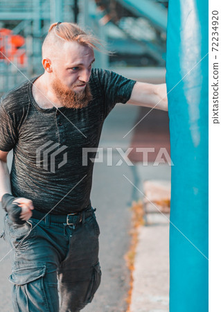 Street Fighter Boxing in Punching Bag Outdoors Street Fighter Boxing in Punching Bag Outdoors 72234920