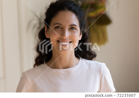 Head shot portrait smiling attractive woman looking at camera Head shot portrait smiling attractive woman looking at camera 72235007