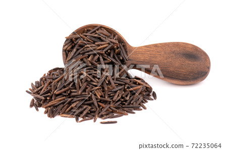 Wild black rice in wooden spoon, isolated on white background. 72235064