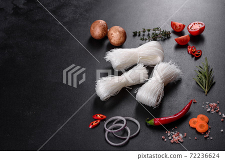 Tasty rice noodles with tomato, red pepper, mushrooms and seafood 72236624