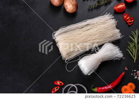 Tasty rice noodles with tomato, red pepper, mushrooms and seafood 72236625