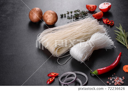 Tasty rice noodles with tomato, red pepper, mushrooms and seafood 72236626