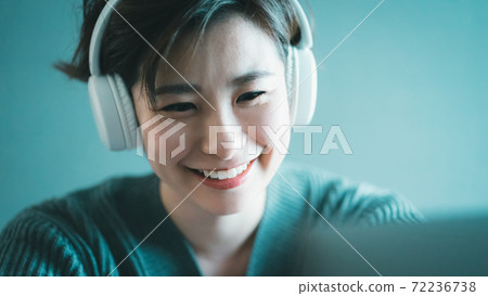 Headphones laughing woman Headphones laughing woman 72236738