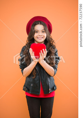 Love is in the air. parisian fashion girl hold red heart. world 72237590