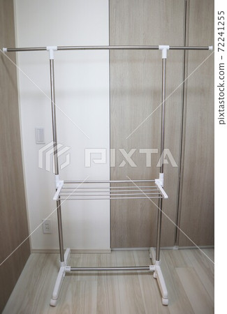 Simple indoor clothesline in the room Simple indoor clothesline in the room 72241255
