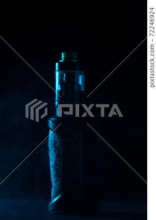 vape close-up in a smoke on a black background vape close-up in a smoke on a black background 72246924
