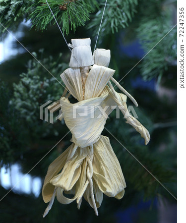 Christmas decoration, handicraft toys made of straw, hanging on a Christmas tree before New Year Day Christmas decoration, handicraft toys made of straw, hanging on a Christmas tree before New Year Day 72247356