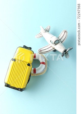 Taking a picture of a trip using a miniature model of an airplane or suitcase Taking a picture of a trip using a miniature model of an airplane or suitcase 72247368