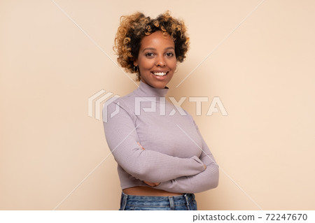 African american millennial woman looking at camera 72247670