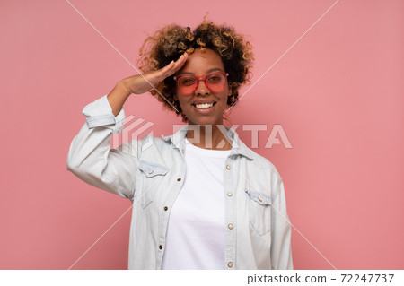 Young african woman saluting showing her patriotism. 72247737