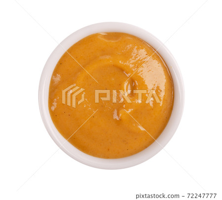 Mustard sauce in bowl, isolated on white background. Honey mustard salad dressing. Top view. Mustard sauce in bowl, isolated on white background. Honey mustard salad dressing. Top view. 72247777