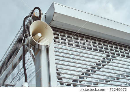 Speaker for announcing outdoor. Public megaphone on building construction 72249072