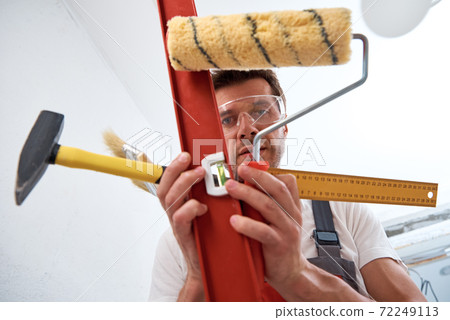 Builder man with construction tools. Repair concept Builder man with construction tools. Repair concept 72249113