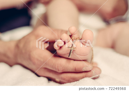 Baptism of a baby, close up of tiny baby feet, sacrament of baptism. 72249368