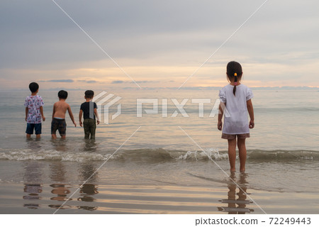 Children group brother sister playing on the beach with equality diversity social bullying concept Children group brother sister playing on the beach with equality diversity social bullying concept 72249443