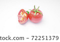 Tomatoes in greenery over white background 72251379