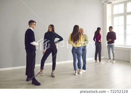 People standing in pairs and getting to know each other in group therapy session People standing in pairs and getting to know each other in group therapy session 72252129