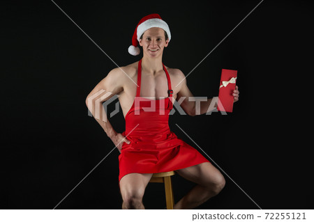 I have gift for you. Macho muscular torso posing with gift I have gift for you. Macho muscular torso posing with gift 72255121