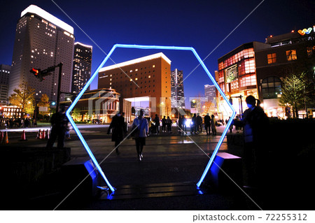 Yokohama cityscape of Japan A hexagonal gate that glows blue and fantastically. (Yokohama Landmark Tower in the back, etc.) = December 6 72255312