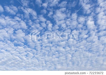 Blue sky background with white clouds on sunny day. 72255672