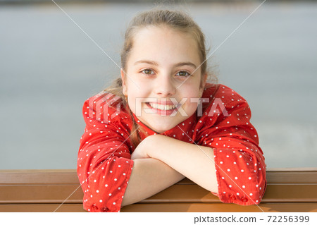 Experiencing the perfect skin. Happy little girl enjoying  72256399