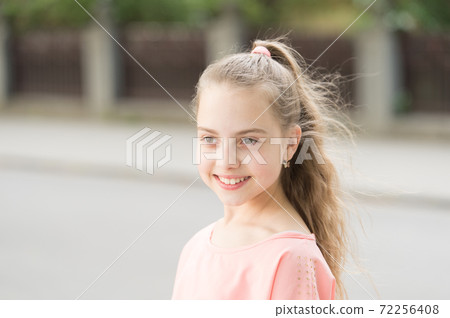Beauty is but skin deep. Cute little girl enjoying smooth  72256408