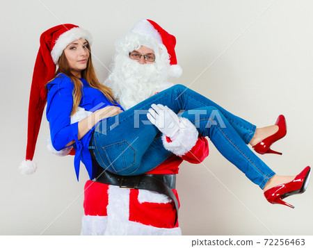 Attractive lady with Santa Claus. Attractive lady with Santa Claus. 72256463