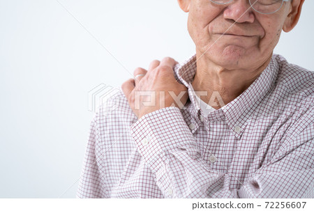 Senior man suffering from stiff shoulders front up Senior man suffering from stiff shoulders front up 72256607