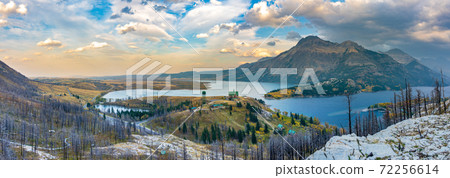 Panorama view of Town of Waterton Lakes National Park in beautiful dusk. Landscape scenery after Wildfire in 2020 autumn foliage season. Alberta, Canada. Panorama view of Town of Waterton Lakes National Park in beautiful dusk. Landscape scenery after Wildfire in 2020 autumn foliage season. Alberta, Canada. 72256614