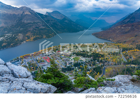 View of Town of Waterton Lakes National Park in dusk. Landscape scenery in autumn foliage season. Alberta, Canada. 72256616