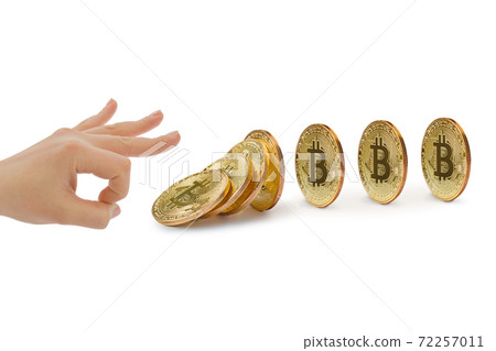Hand and falling bitcoins 72257011