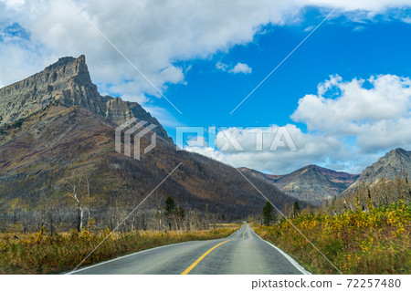 Red Rock Canyon Parkway in autumn sunny day morning. Waterton Lakes National Park, Alberta, Canada. 72257480