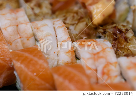 Tasty delicious chinese cuisine rolls and seafood sushi close up. Tasty delicious chinese cuisine rolls and seafood sushi close up. 72258014