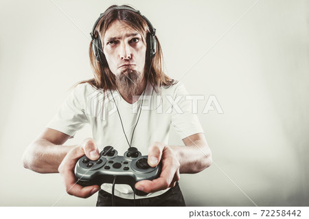 Unhappy male playing games 72258442