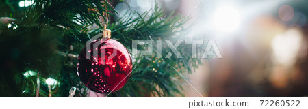 Luxury ornament red ball hang on Christmas tree decorate in supermarket 72260522