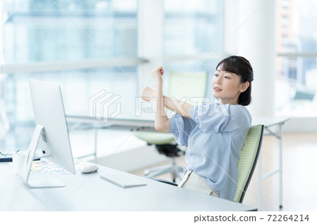 Woman stretching in the office 72264214