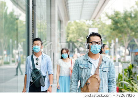 People walking down street People walking down street 72267920
