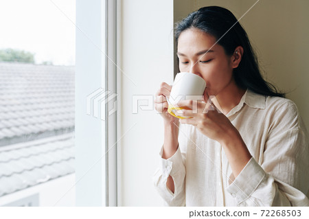 Woman drinking morning coffee Woman drinking morning coffee 72268503