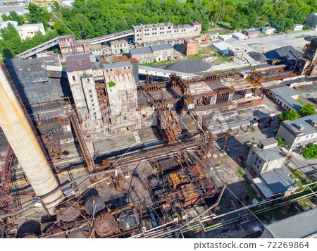 Aerial drone shot of old industrial zone with smoke stack. Air pollution concept Aerial drone shot of old industrial zone with smoke stack. Air pollution concept 72269864