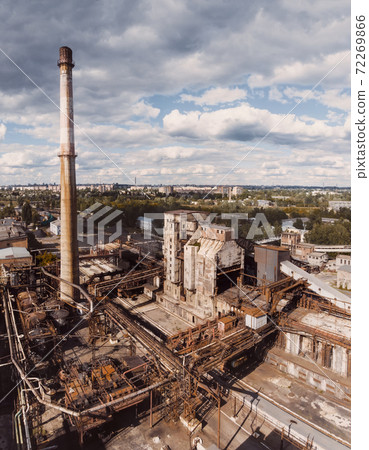 Aerial drone shot of old industrial zone with smoke stack. Air pollution concept Aerial drone shot of old industrial zone with smoke stack. Air pollution concept 72269866