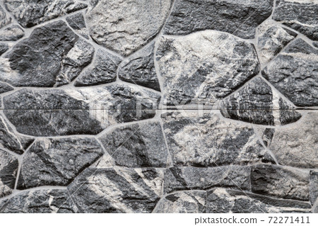 Artificial stone backdrop is similar to natural. 72271411