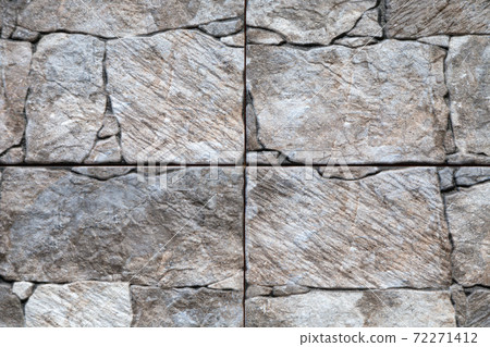 Artificial stone backdrop is similar to natural. 72271412