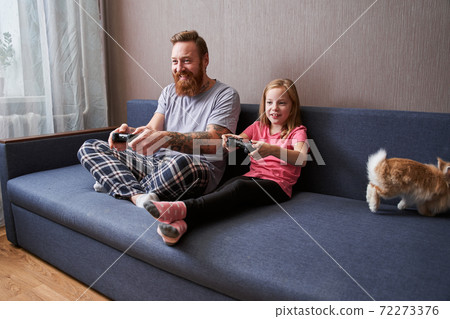 Father and his little girl child having fun Father and his little girl child having fun 72273376