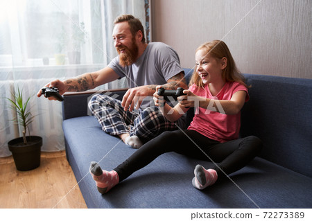 People sitting at the lotus pose and holding joysticks People sitting at the lotus pose and holding joysticks 72273389