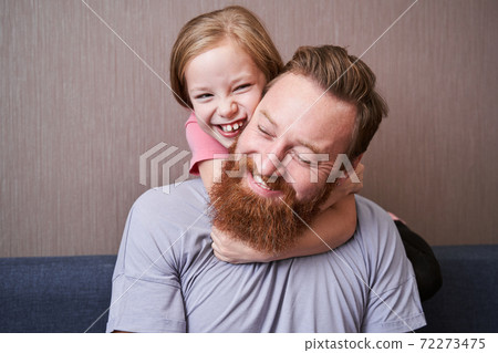 Father embracing cute little child daughter 72273475