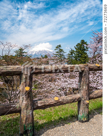 Landscape of mountain Fuji with view of city and benches at foreground Landscape of mountain Fuji with view of city and benches at foreground 72273669