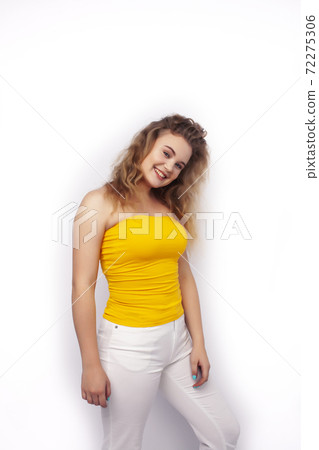 young pretty stylish hipster blond girl posing emotional isolated on white background happy smiling cool smile, lifestyle people concept 72275306