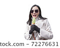 Young woman eating ice cream cone on white background 72276631